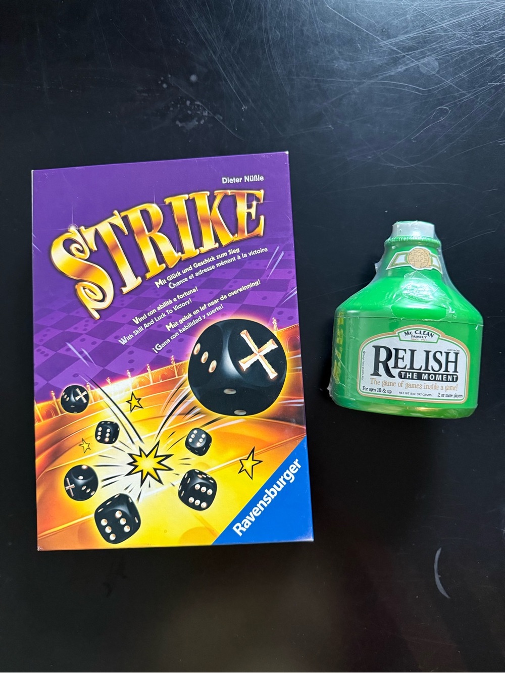 Ravensburger Strike Dice Game and Relish the Moment game.